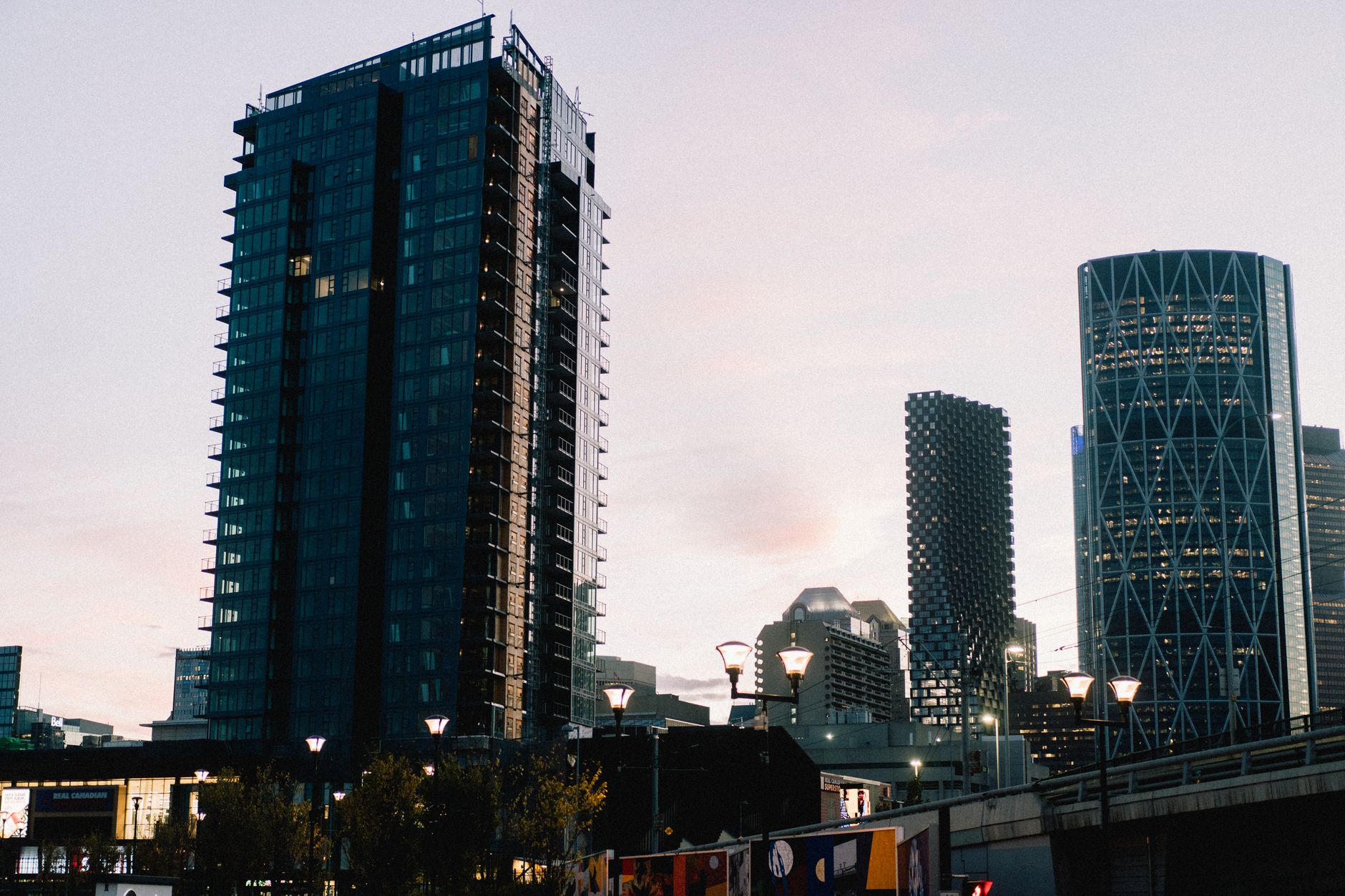 Inner-city Calgary neighbourhood at dusk, the setting around Mount Pleasant Tennis Club's outdoor courts