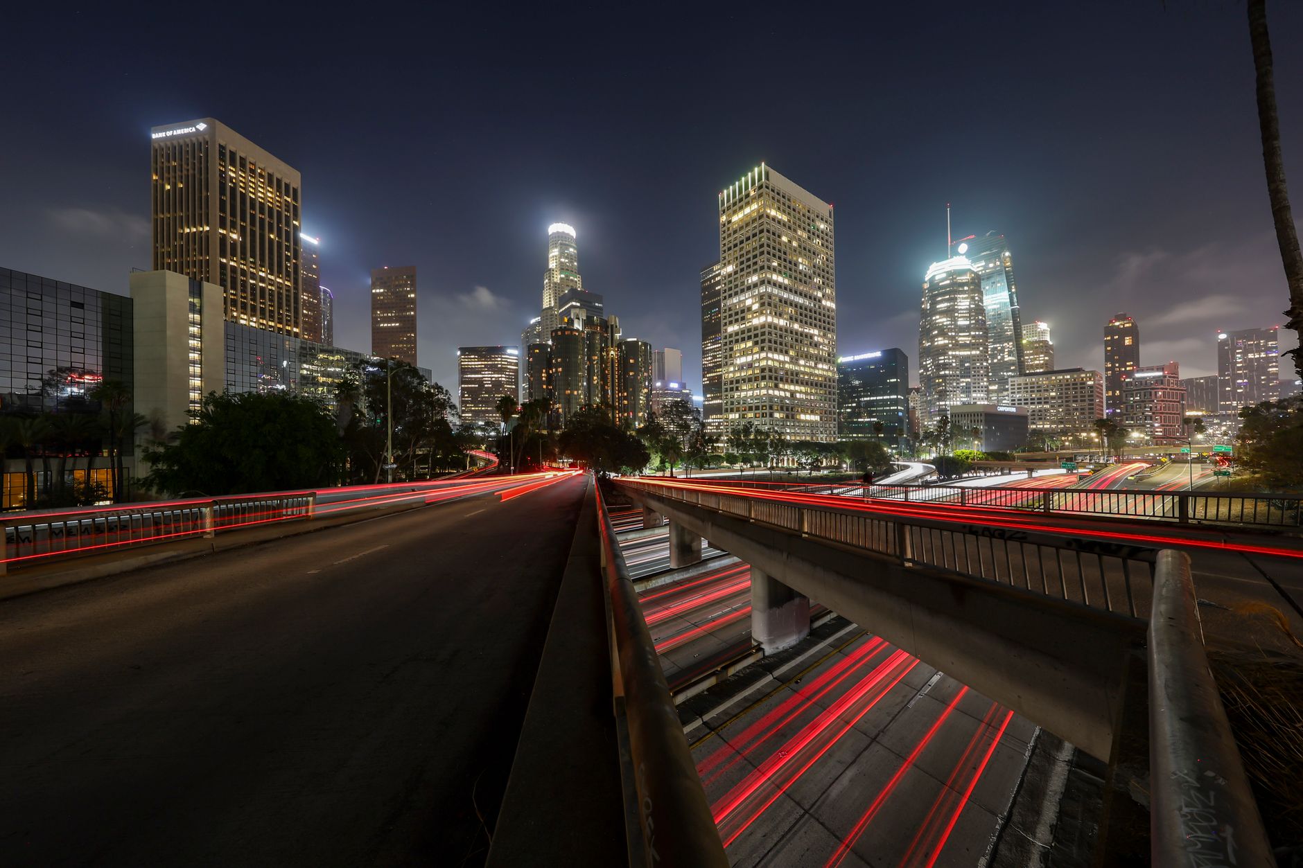 A city park glowing under evening light in central Los Angeles, the setting around Poinsettia Recreation Center's lit courts