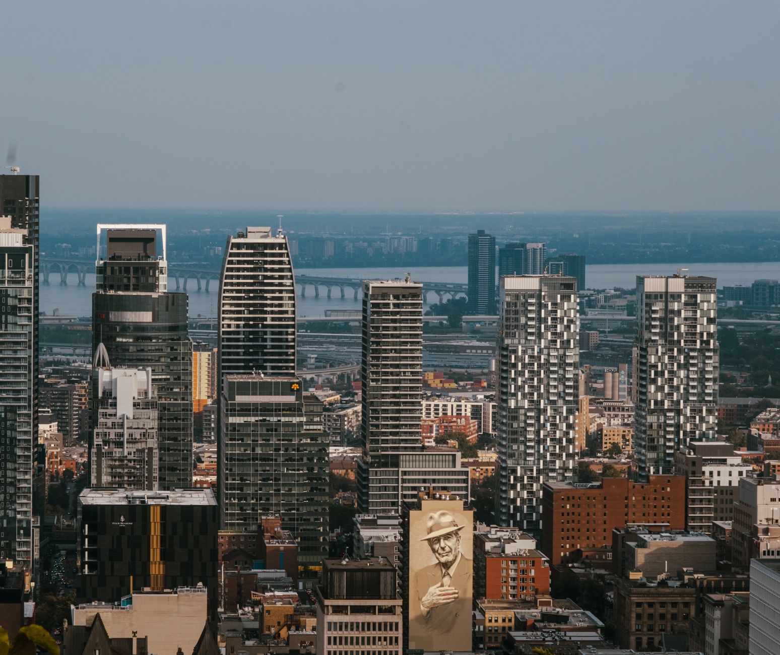 Montreal city skyline at dusk near IGA Stadium's tennis courts