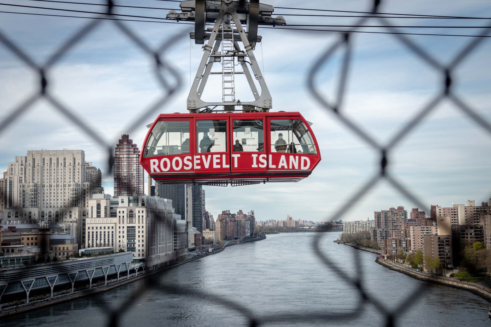 The East River and Long Island City skyline at dusk, the view from Roosevelt Island where Octagon's lit courts sit