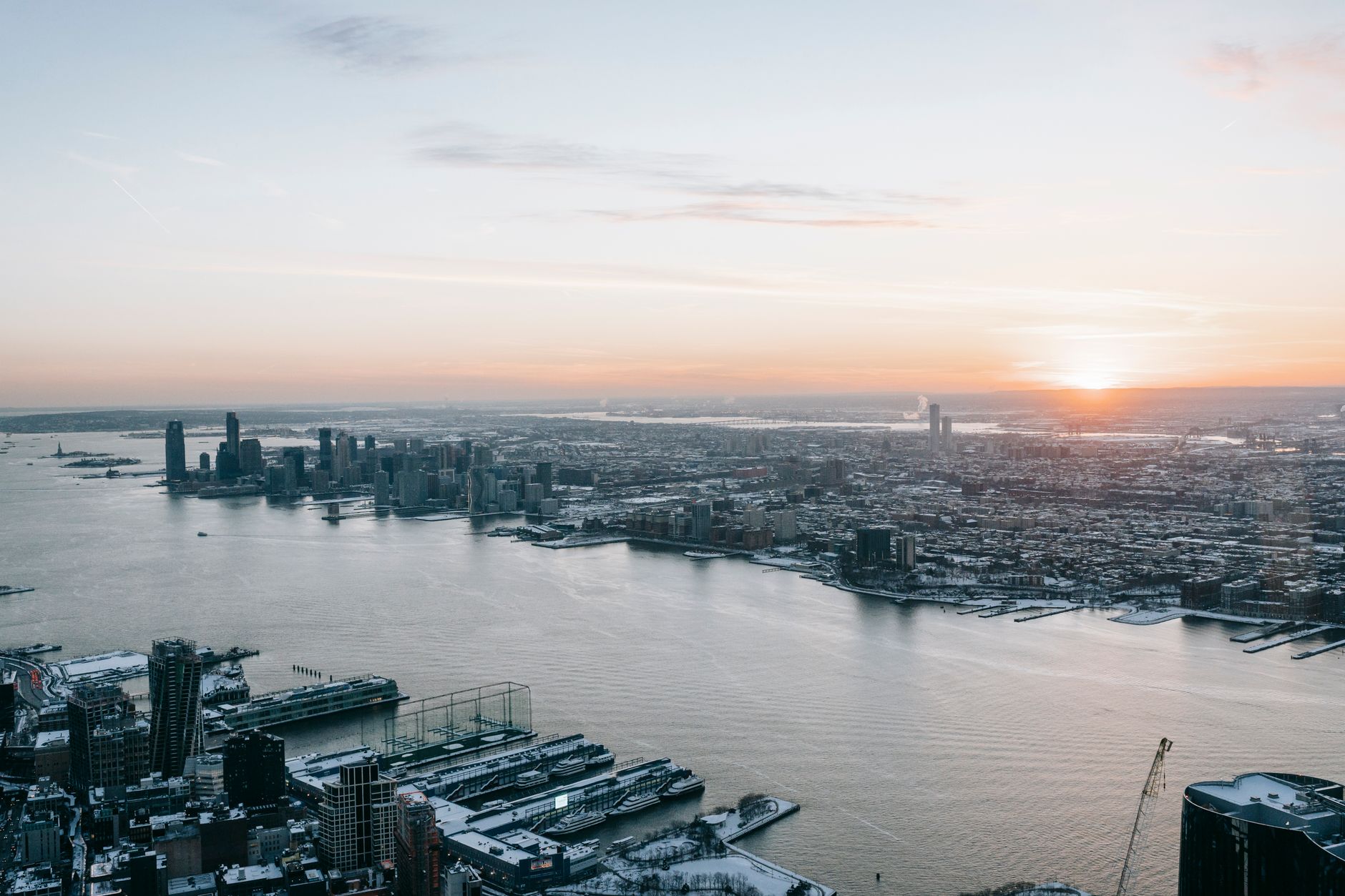 Hudson River and the Manhattan waterfront skyline, the scenic setting of the free Hudson River Park tennis courts
