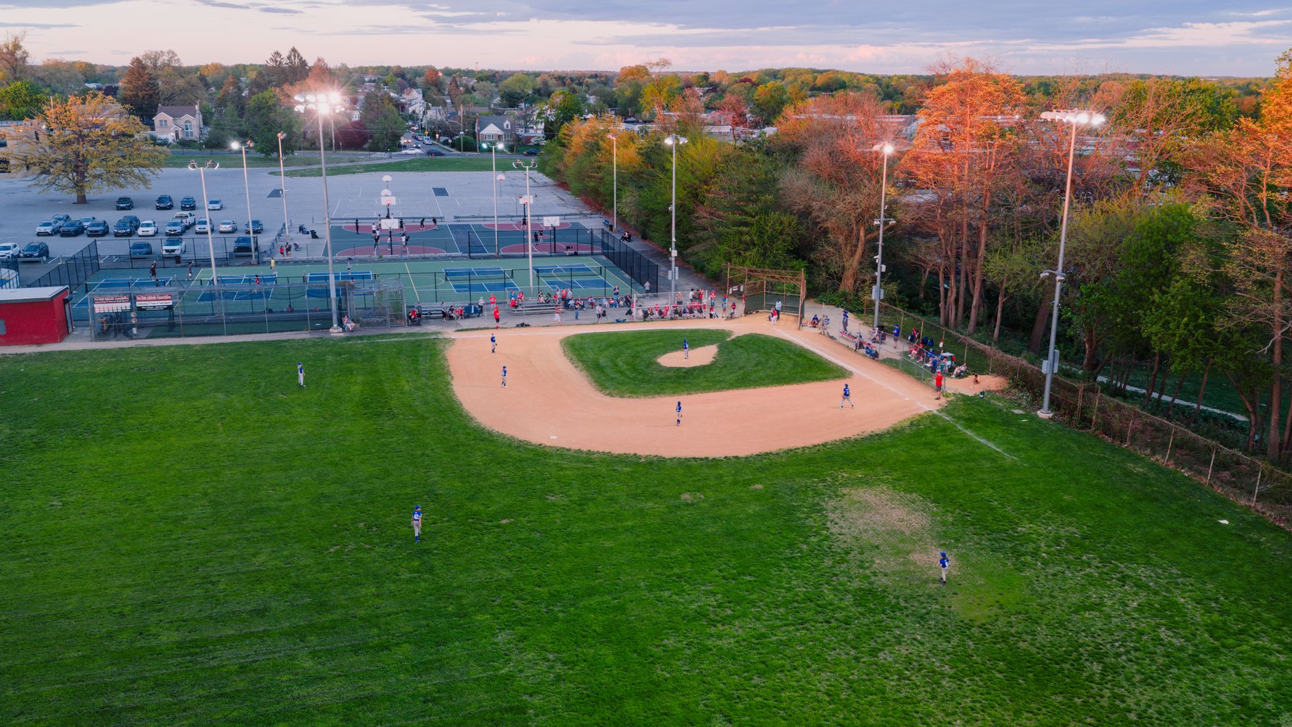 Recently resurfaced public courts with instant-on lights, representative of Promenade Green Park in Vaughan