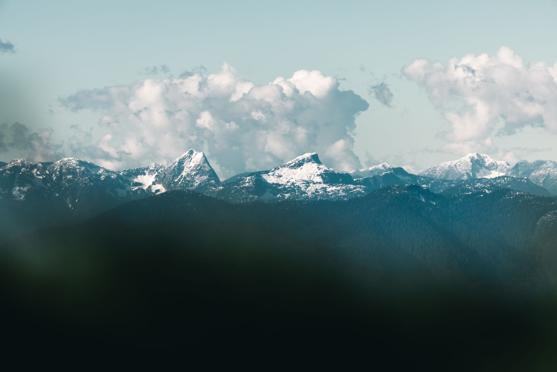 Mountains ringing Coquitlam, where Urban Tennis keeps eight indoor courts running through the wet season