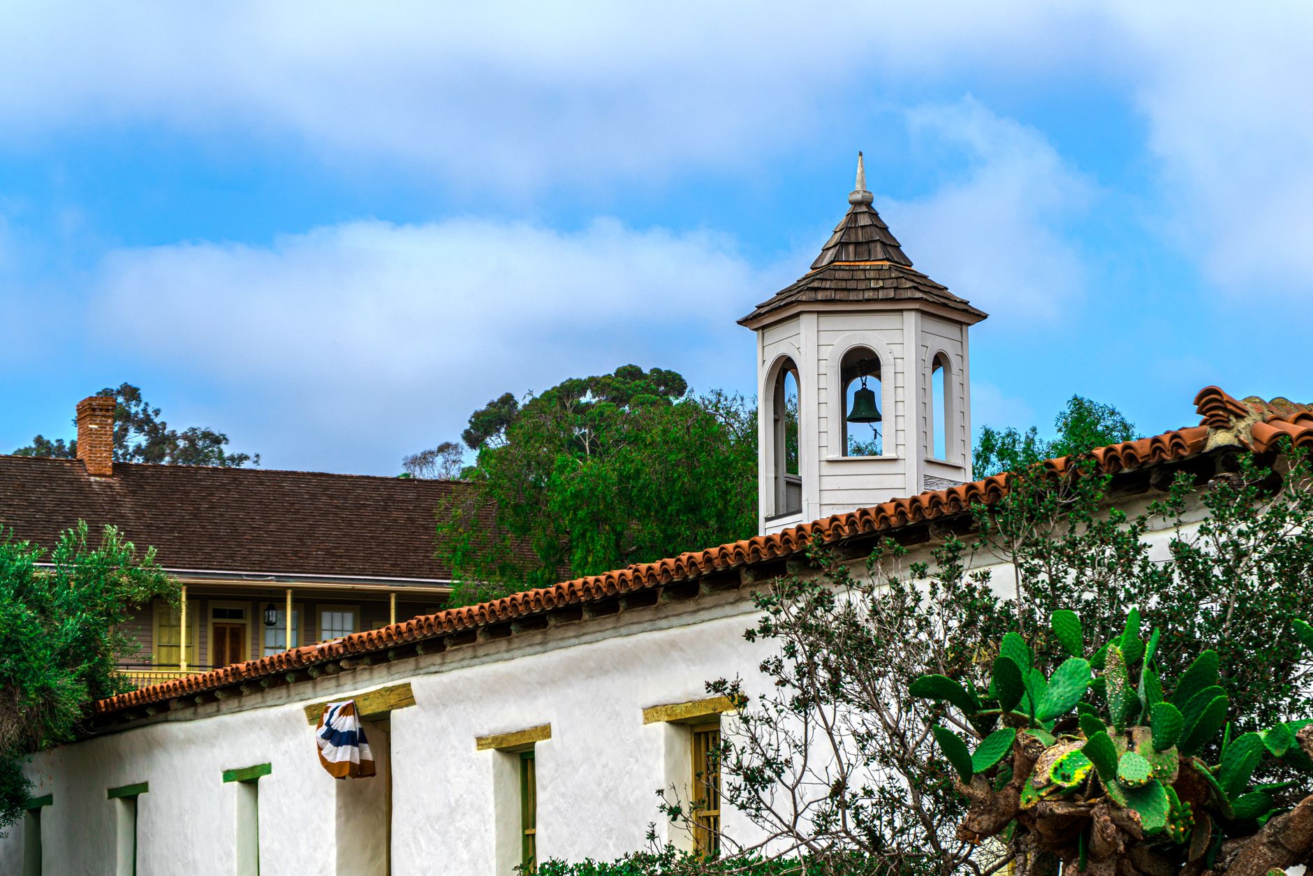 A sunlit Mission Viejo hillside setting, representative of the area where Base Tennis Academy trains
