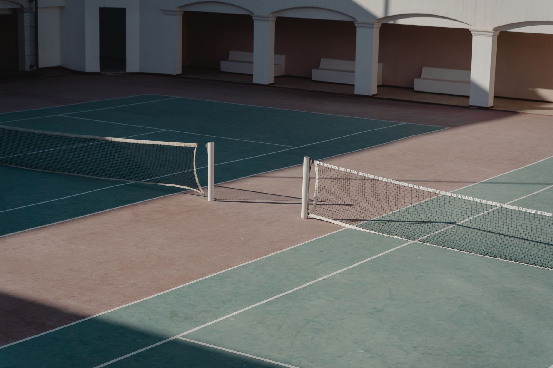Well-kept outdoor tennis courts in a residential setting, representative of the Bayview Village area of North York where the camp coaches