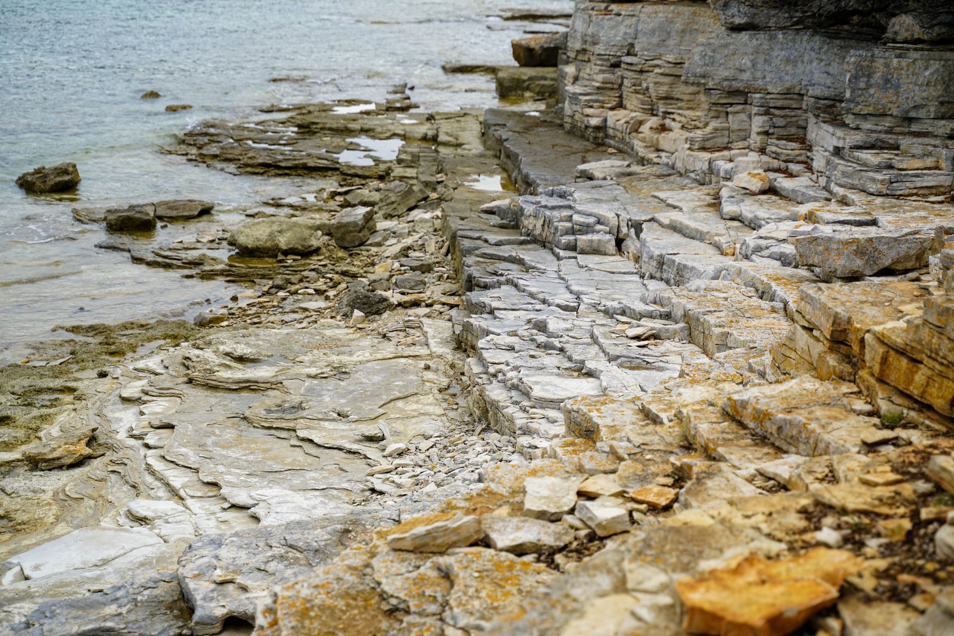 A limestone waterfront in Kingston, Ontario, glowing in the late-day autumn light
