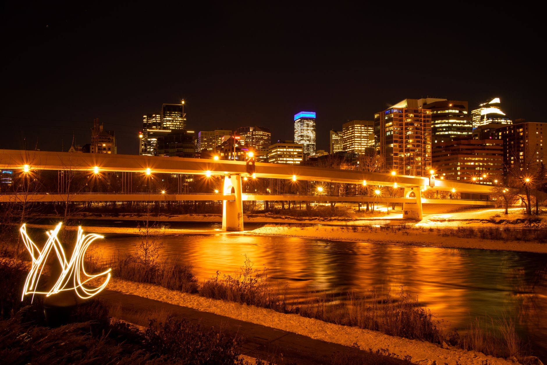 The Bow River winding through green parkland in Calgary, Alberta