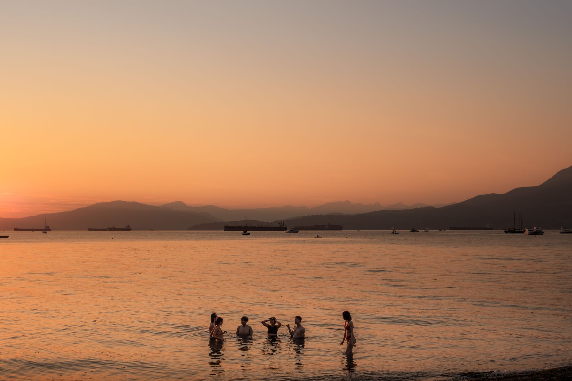 Sandy Kitsilano beach and English Bay water on a bright Vancouver day