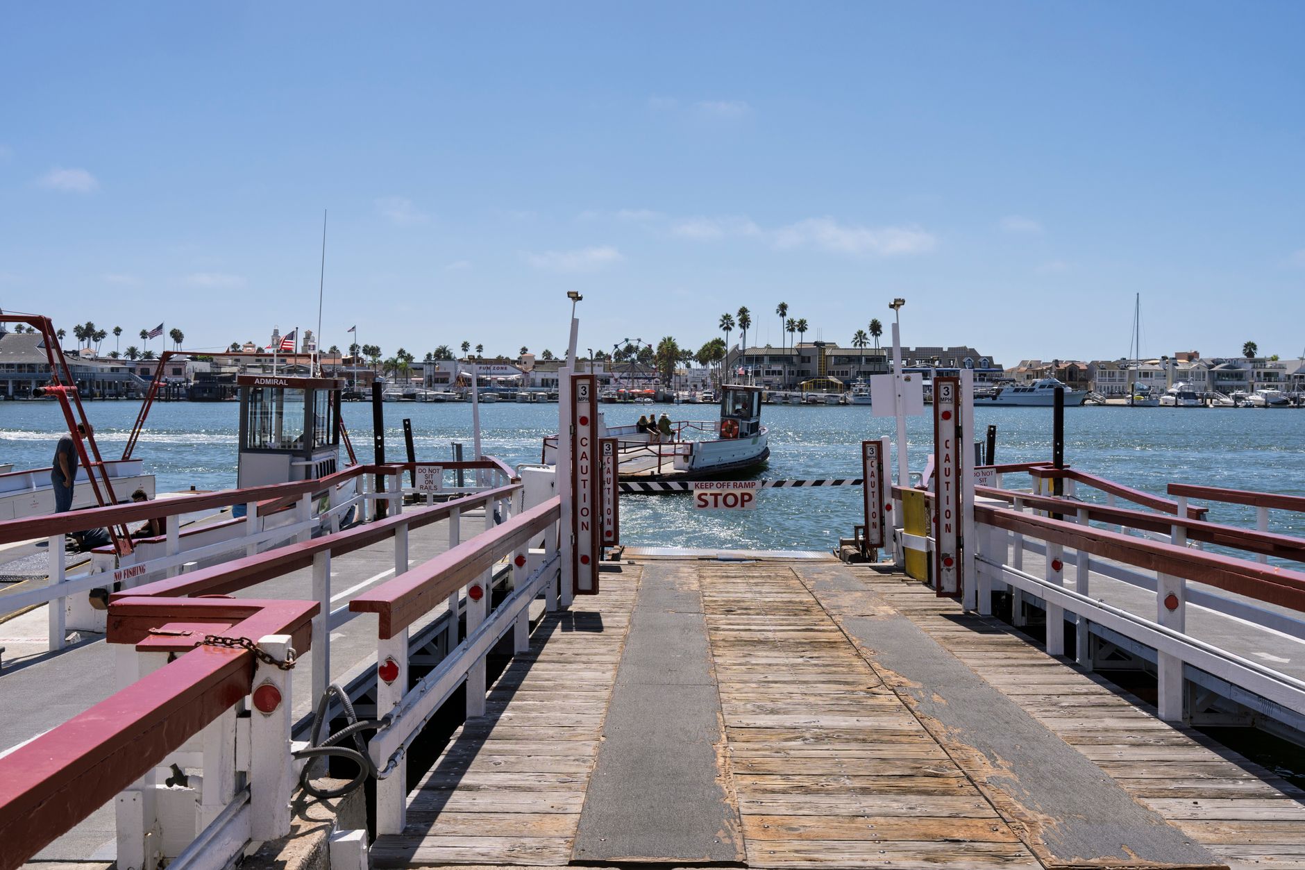 Newport Beach harbor under coastal light, near the Peninsula Point Racquet Club courts