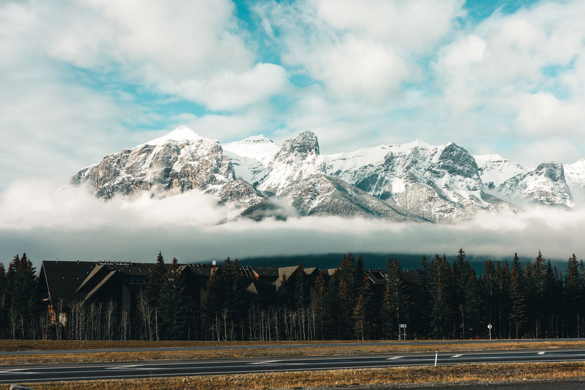 Snow-dusted Rocky Mountains rising above Canmore in the Bow Valley, the setting for Lions Park's courts