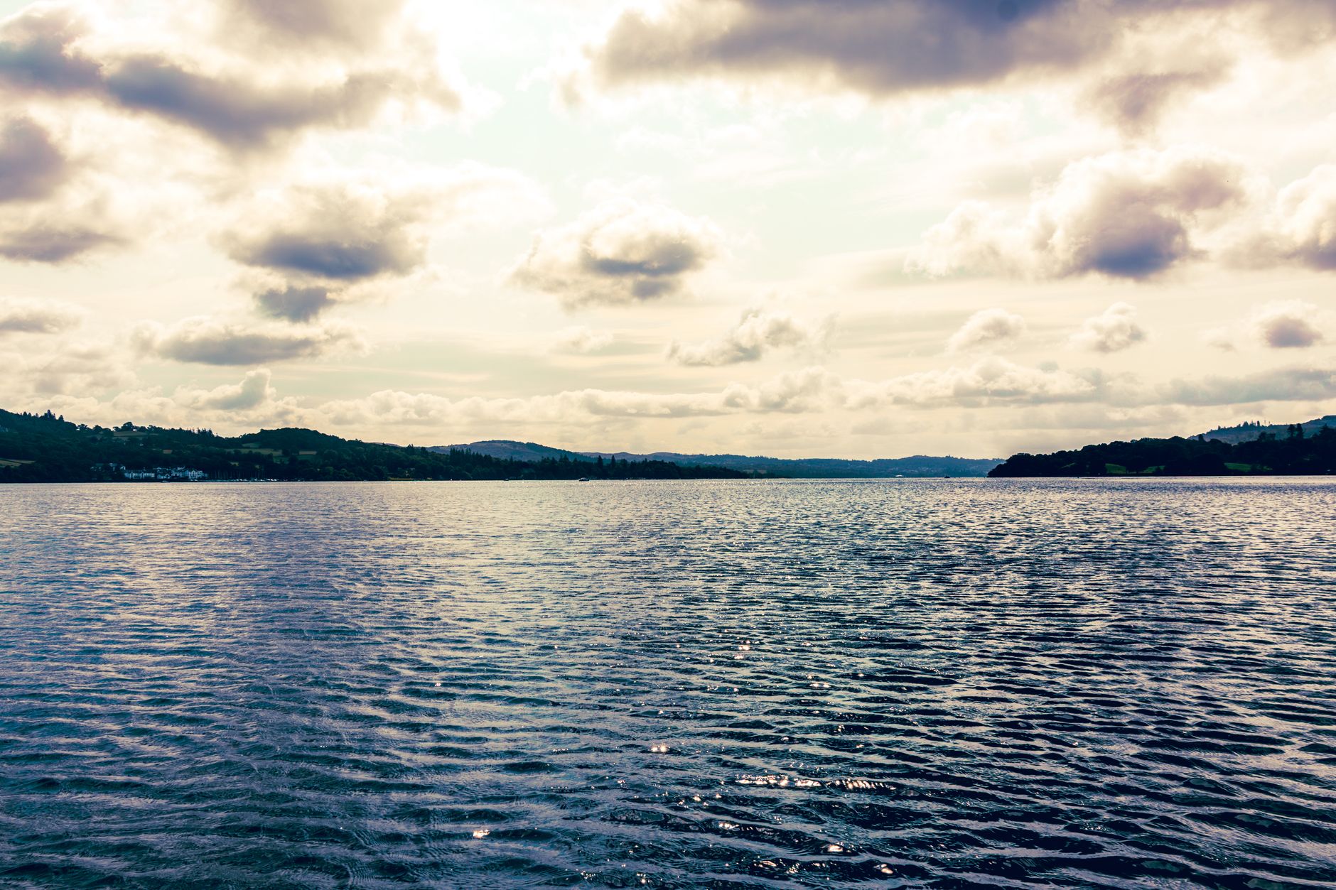 Quiet forested lake in Nanaimo, representative of the park setting around Diver Lake's courts