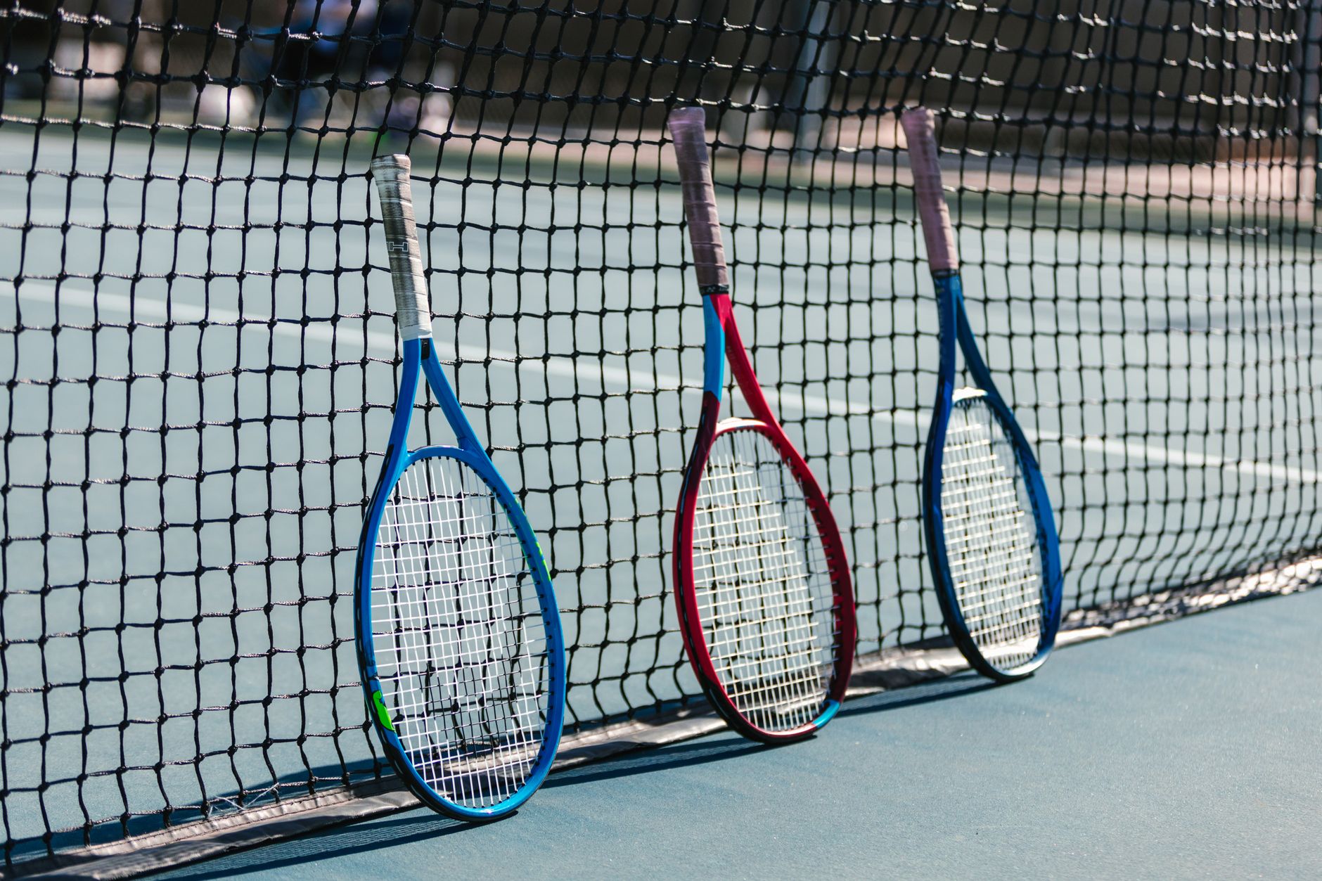 A close-up of a tennis racquet, representing Apex Racquet Werks in La Verne