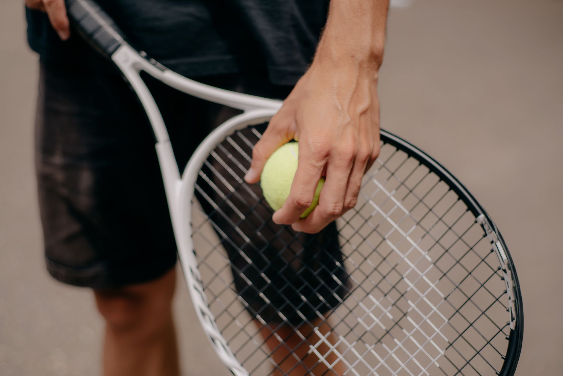 A tennis racquet and strings, representing Of Courts in London, Ontario